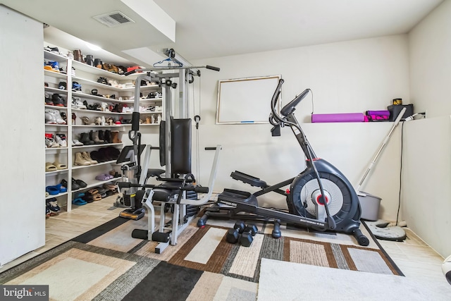 workout room featuring visible vents