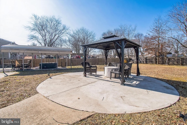 view of patio with a fenced backyard and a gazebo