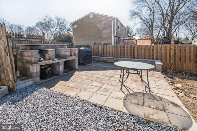 view of patio / terrace featuring grilling area and fence