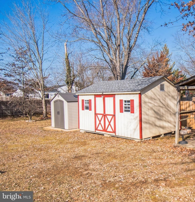 view of shed with fence