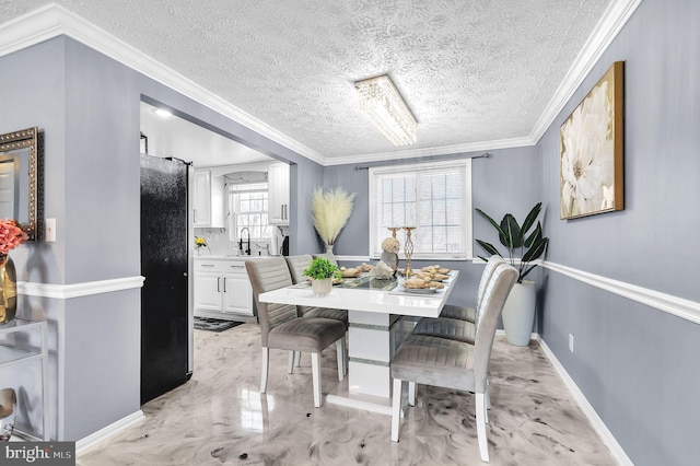 dining area with marble finish floor, baseboards, ornamental molding, and a textured ceiling