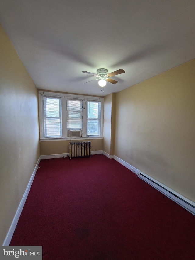 unfurnished room featuring radiator, ceiling fan, and carpet