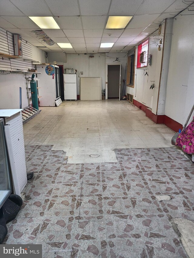 garage with white refrigerator