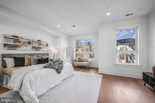 bedroom with hardwood / wood-style flooring