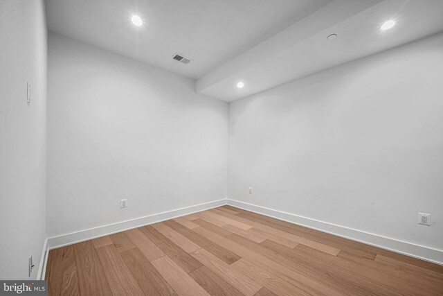 spare room featuring hardwood / wood-style floors