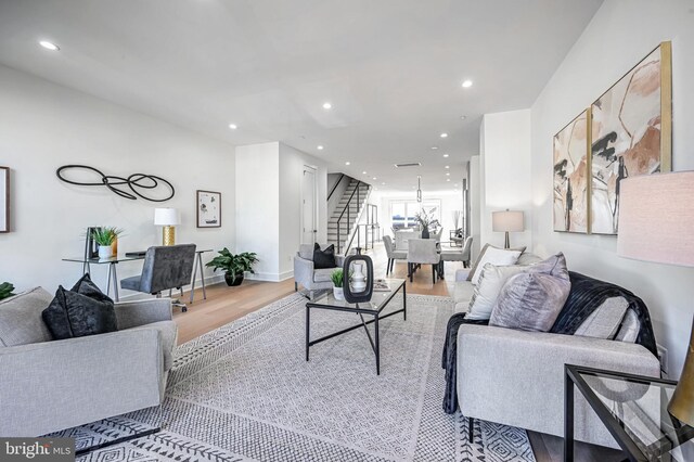 living room with light hardwood / wood-style flooring