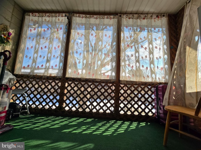 sunroom / solarium featuring wooden ceiling