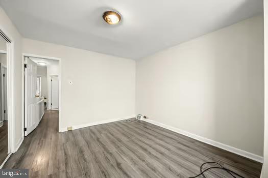 empty room featuring dark hardwood / wood-style floors