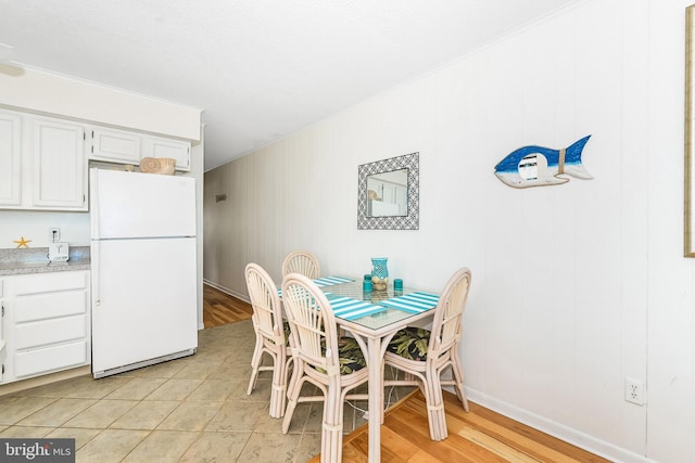 dining room featuring light hardwood / wood-style floors