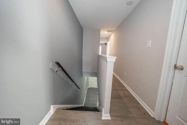 stairway featuring hardwood / wood-style flooring