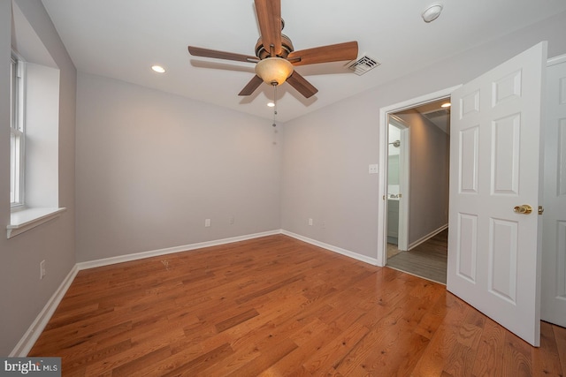 unfurnished room with ceiling fan and light hardwood / wood-style flooring