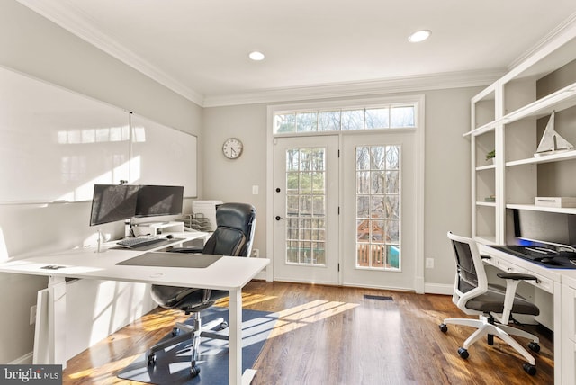 office area featuring hardwood / wood-style flooring and crown molding