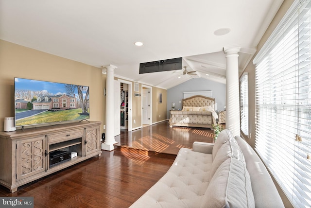 bedroom featuring ceiling fan, lofted ceiling, dark hardwood / wood-style flooring, and decorative columns