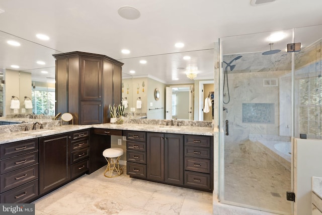 bathroom featuring crown molding, vanity, and separate shower and tub