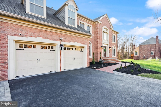 view of side of home with a garage and a lawn