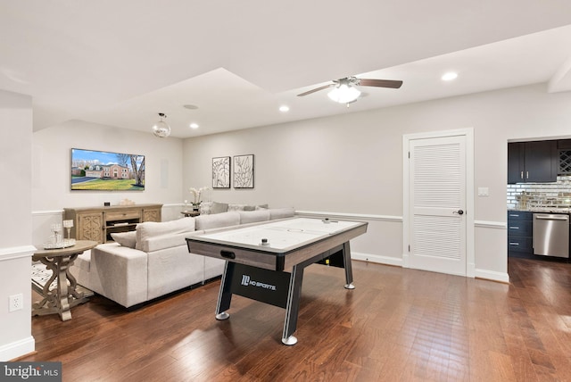 playroom featuring dark wood-type flooring and ceiling fan