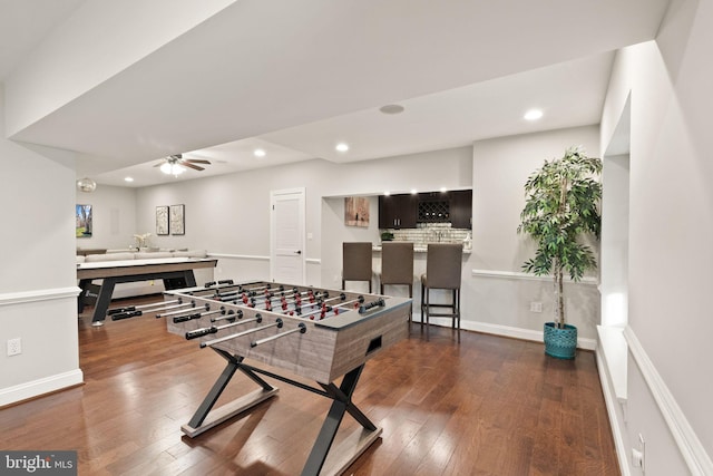 recreation room featuring dark wood-type flooring and ceiling fan