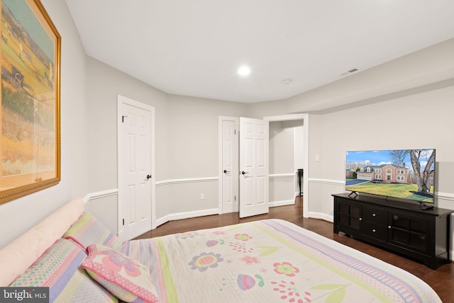 bedroom featuring dark wood-type flooring