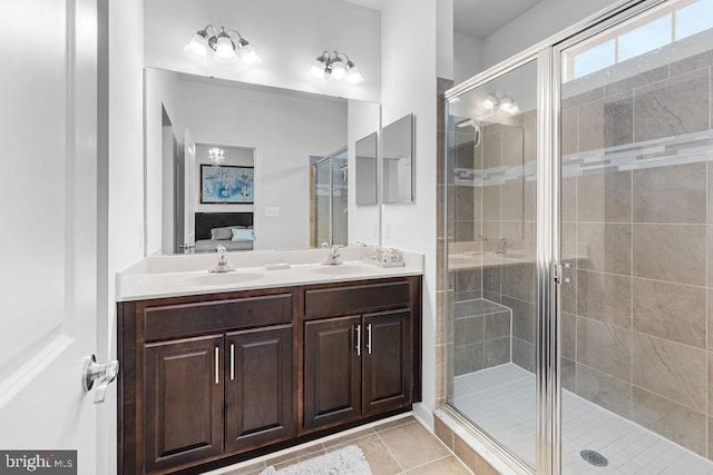 bathroom with walk in shower, tile patterned floors, and vanity