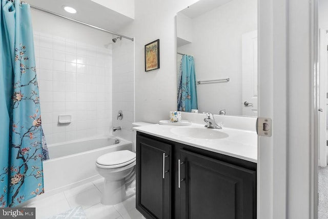 full bathroom with vanity, toilet, tile patterned flooring, and shower / bath combo