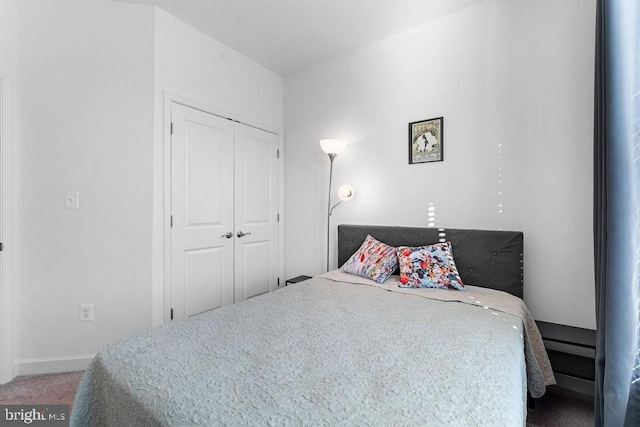 bedroom featuring a closet and carpet