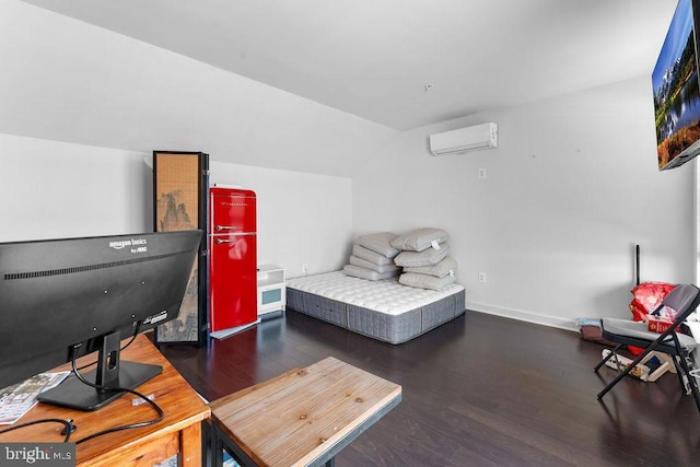 bedroom with dark wood-type flooring, lofted ceiling, and a wall mounted air conditioner