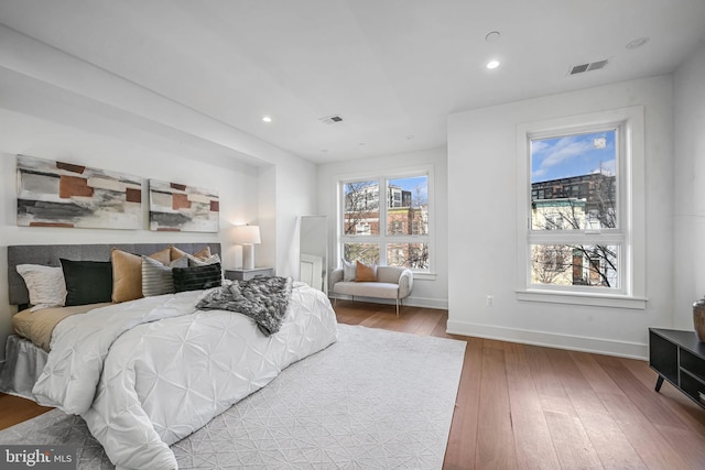 bedroom with hardwood / wood-style floors