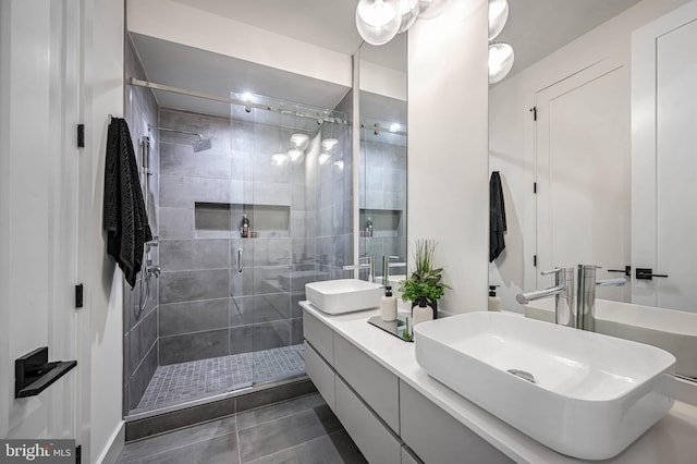 bathroom with vanity, tile patterned floors, and walk in shower