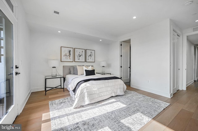 bedroom with light hardwood / wood-style floors