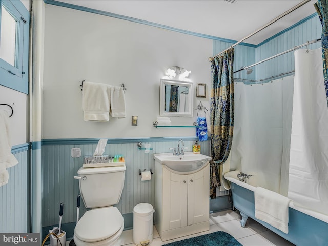 full bathroom with shower / tub combo with curtain, vanity, tile patterned floors, and toilet