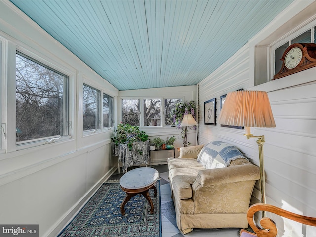 sunroom / solarium featuring wood ceiling