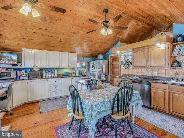 kitchen featuring sink, stainless steel appliances, light hardwood / wood-style floors, and white cabinets