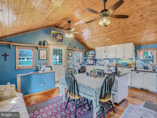 dining area with wood ceiling, ceiling fan, vaulted ceiling, and light wood-type flooring