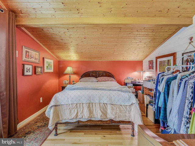 bedroom with wood ceiling, light wood-type flooring, and vaulted ceiling with beams