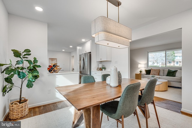 dining room featuring light hardwood / wood-style flooring