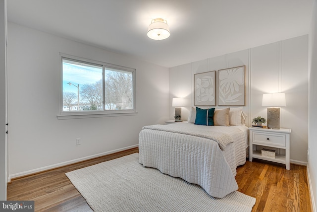 bedroom with hardwood / wood-style flooring