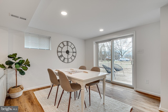 dining room with light wood-type flooring