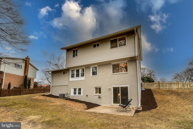 back of house with a patio, central AC, and a lawn