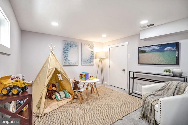 game room featuring light colored carpet