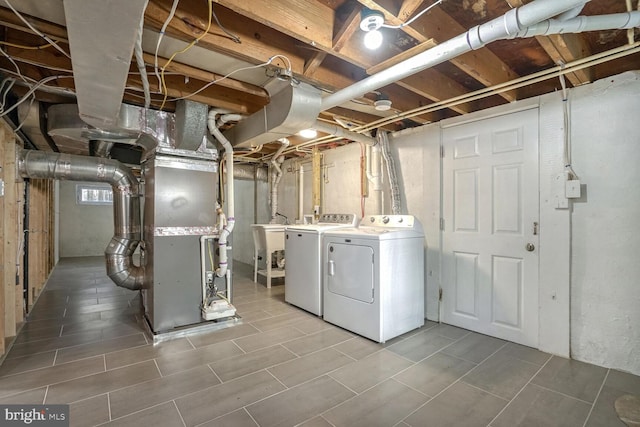 basement featuring washer and clothes dryer