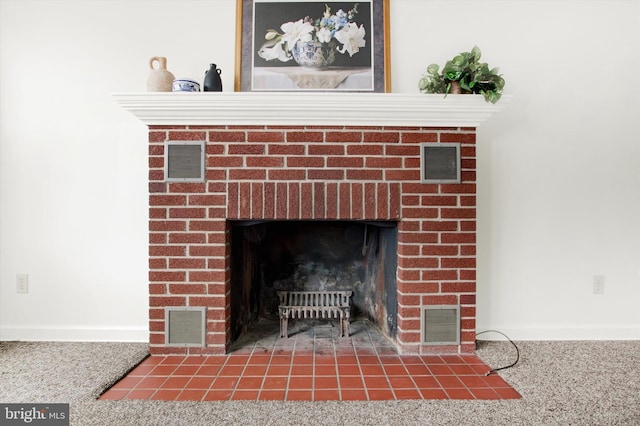 interior details with a fireplace and carpet