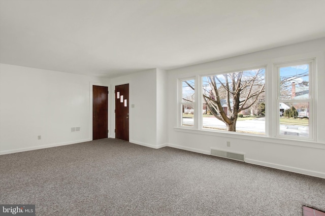 empty room with carpet flooring