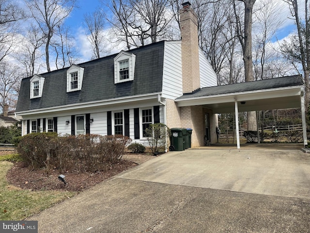 view of front of home with a carport