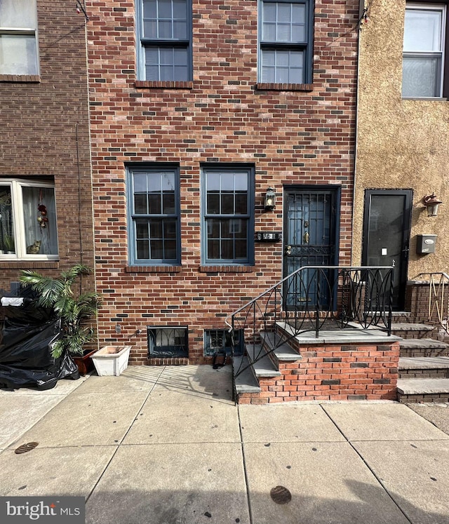 doorway to property featuring a patio