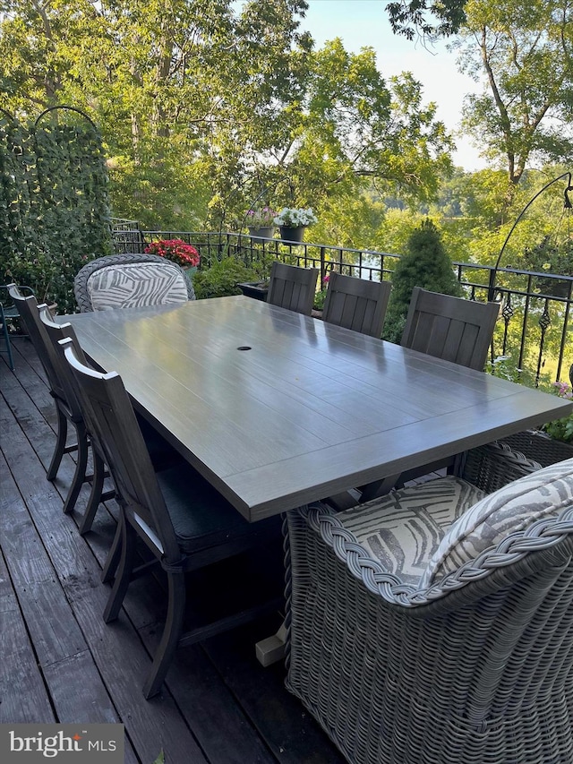 wooden terrace with outdoor dining space