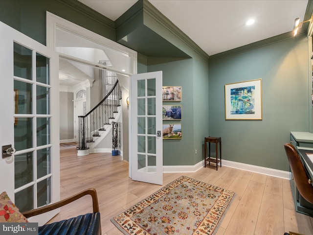 office space with french doors, wood-type flooring, baseboards, and ornamental molding