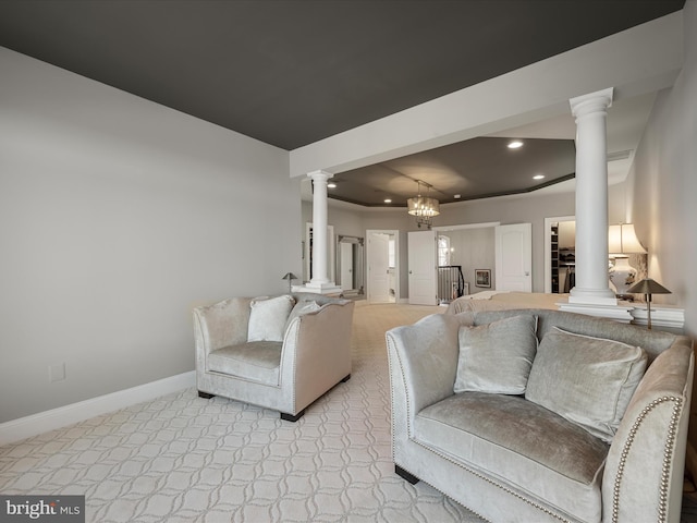 living room featuring recessed lighting, baseboards, light colored carpet, and ornate columns