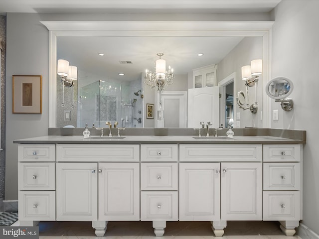 full bathroom with double vanity, recessed lighting, a stall shower, and a sink