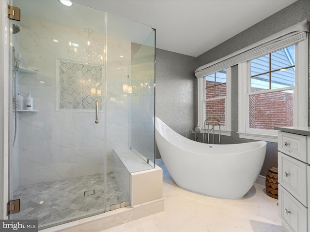 full bathroom with a marble finish shower, a soaking tub, marble finish floor, and vanity