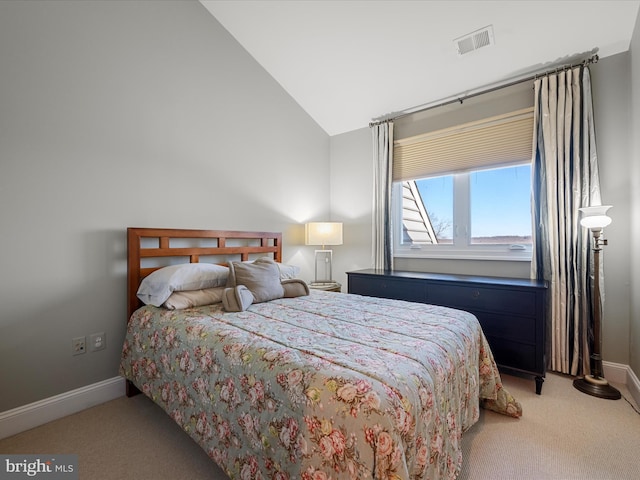 bedroom featuring visible vents, light colored carpet, baseboards, and lofted ceiling